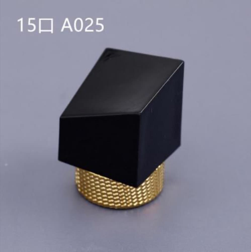 Actual black angled cap with gold knurled inner ring